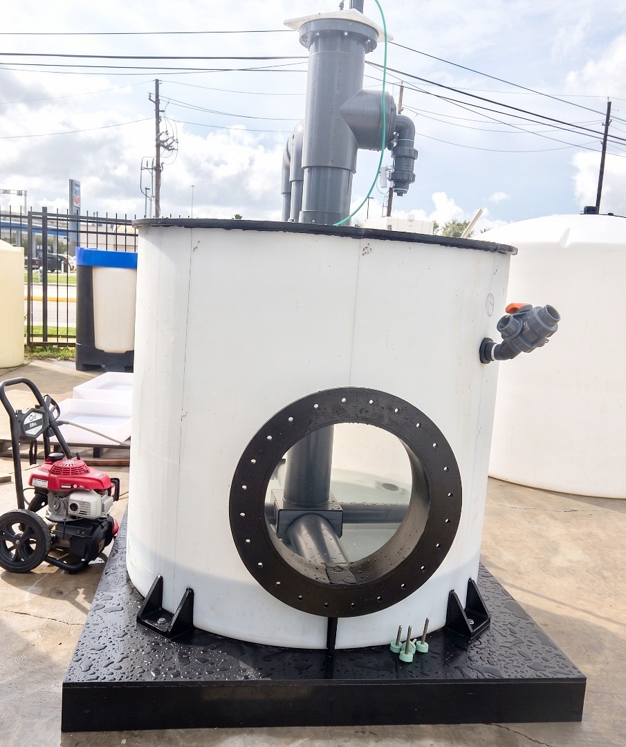 Custom polypropylene tank with fittings and internal air sparging plumbing setup visible through a large circular, sidewall-mounted viewport