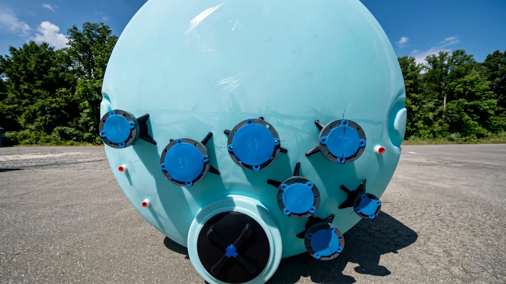 Custom outfitted bulk vertical poly chemical storage tank with seven uniquely placed flange connection fittings