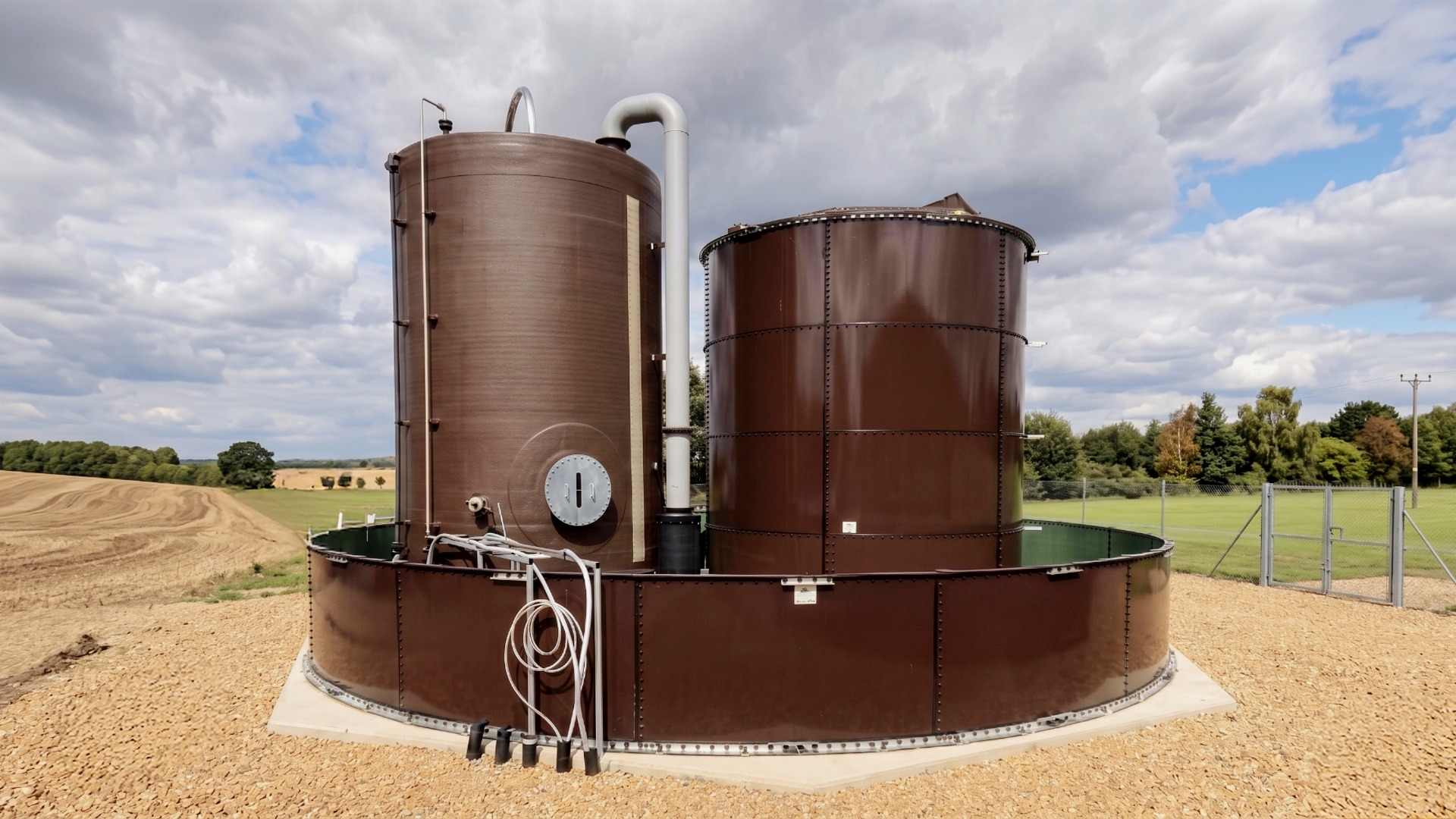 Epoxy coated steel bolted tanks field positioned for chemical storage, receipt, and distribution.