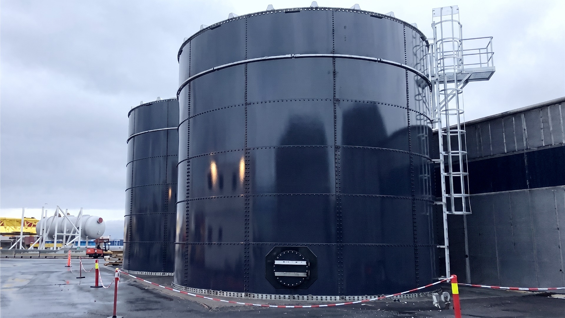 Image of two high capacity steel water tanks for makeup water reserves and data center concurrent maintainability requirements