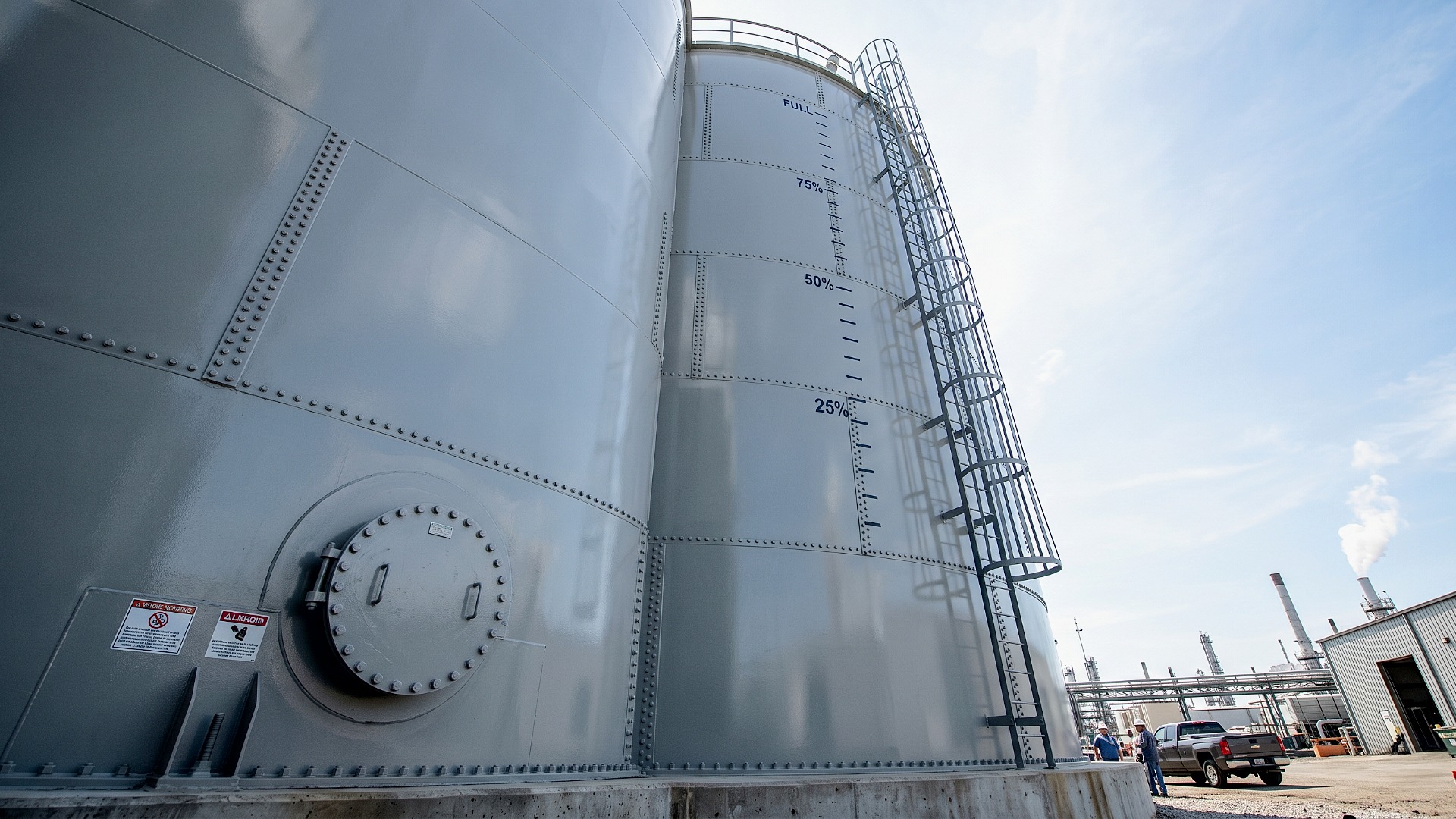 Large capacity gray industrial steel wastewater treatment storage tanks with ladders